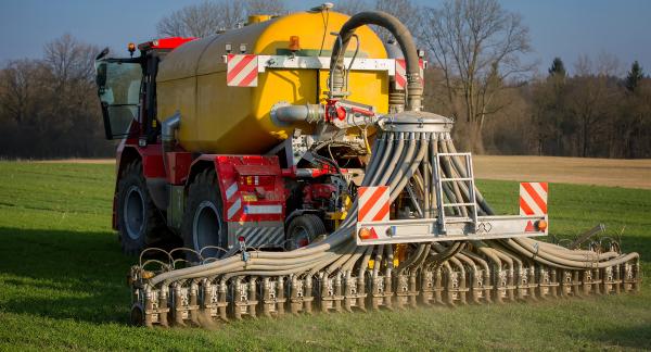 tractor with tank that can directly inject liquid manure into the ground for optimum nutrient placement and odor control