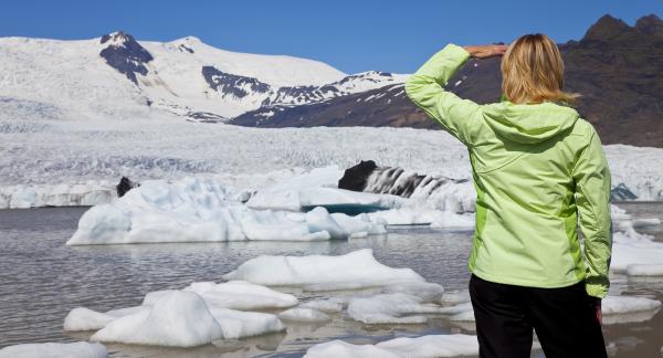glaciers melting with woman in foreground